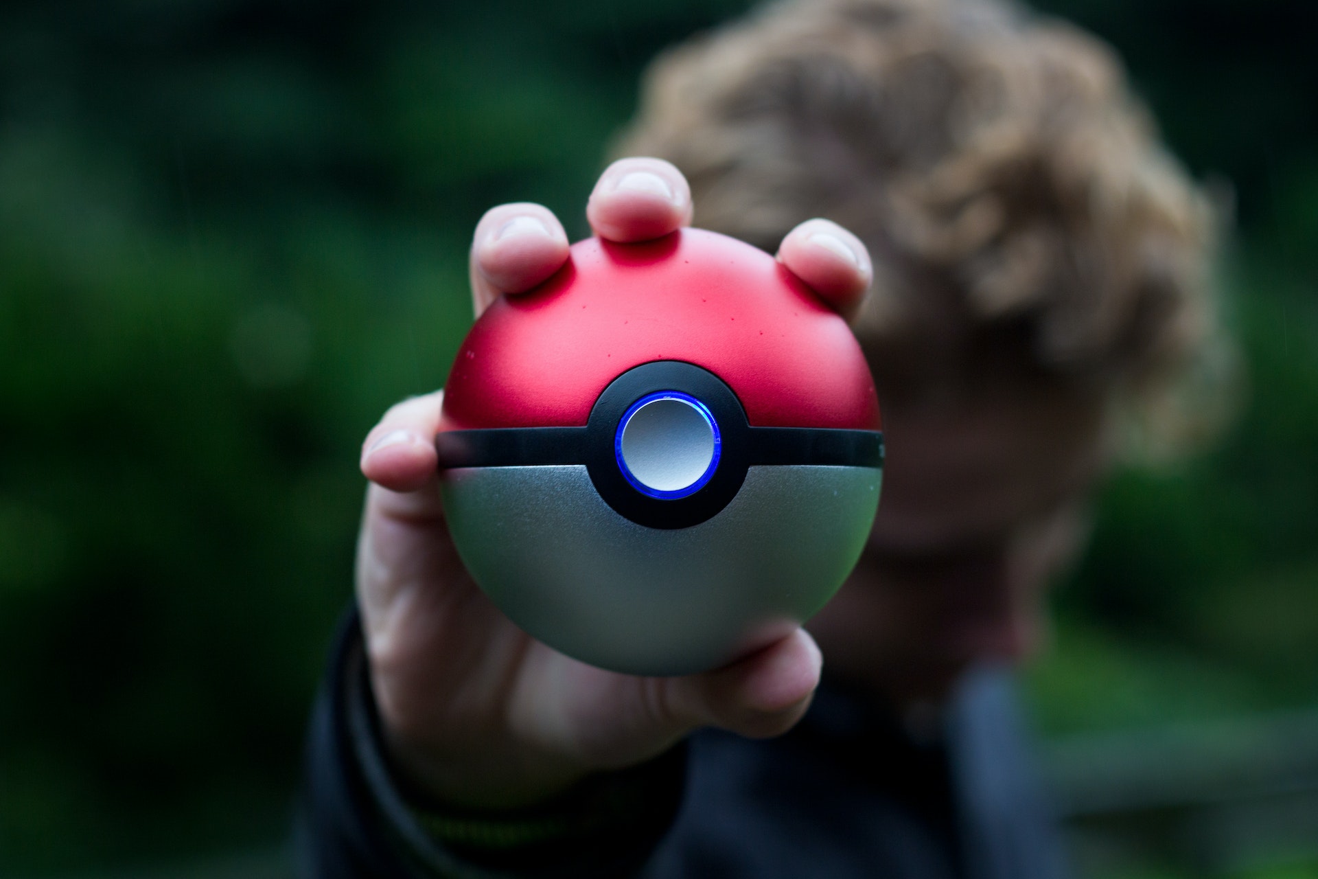 image of a person holding a poke ball